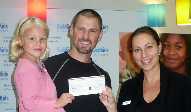Chris Beatty presents cheque to Sick Kids\' Hospital